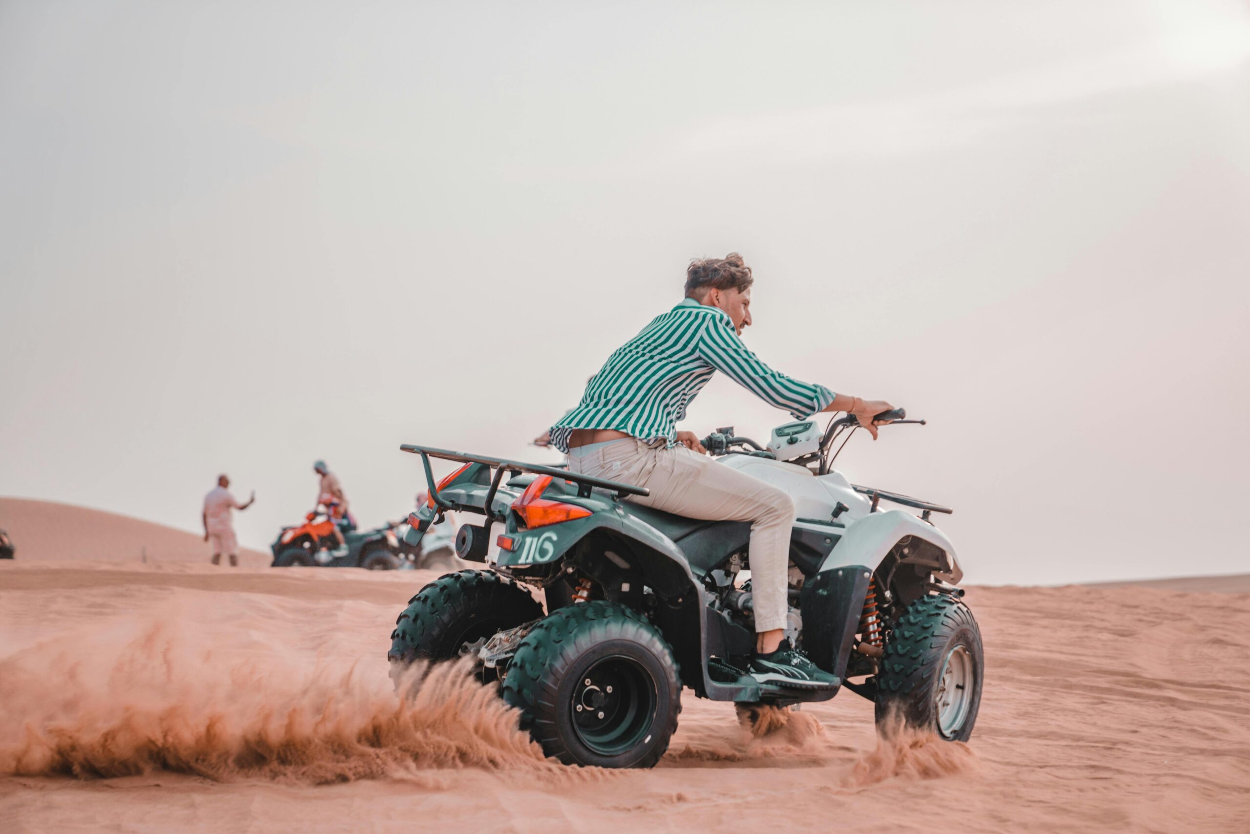 Adventure-filled Quad Bike Safari with sandboarding and delicious BBQ dinner in Dubai desert.