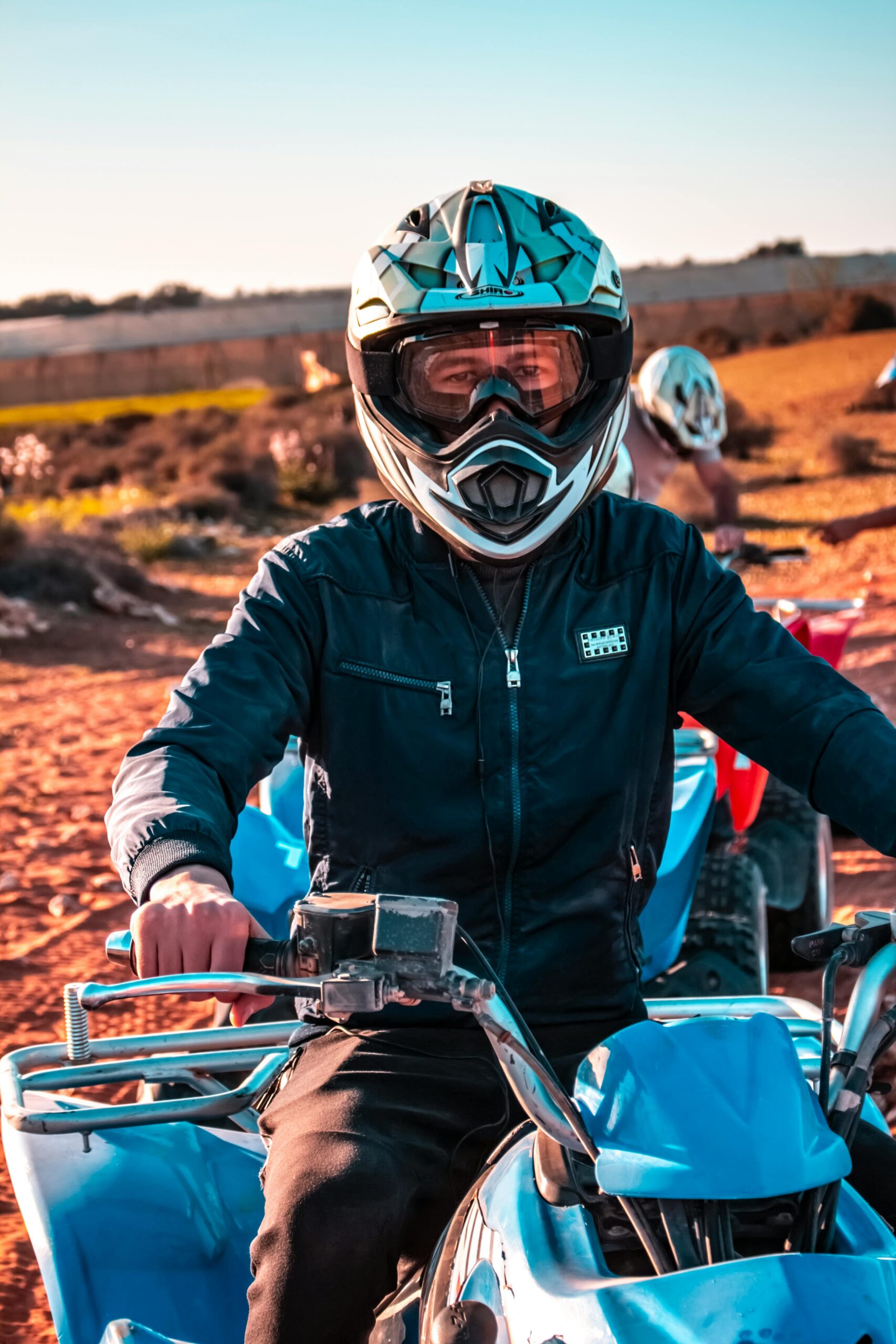 Desert quad bike safari with sandboarding fun and evening BBQ dinner experience in Dubai.