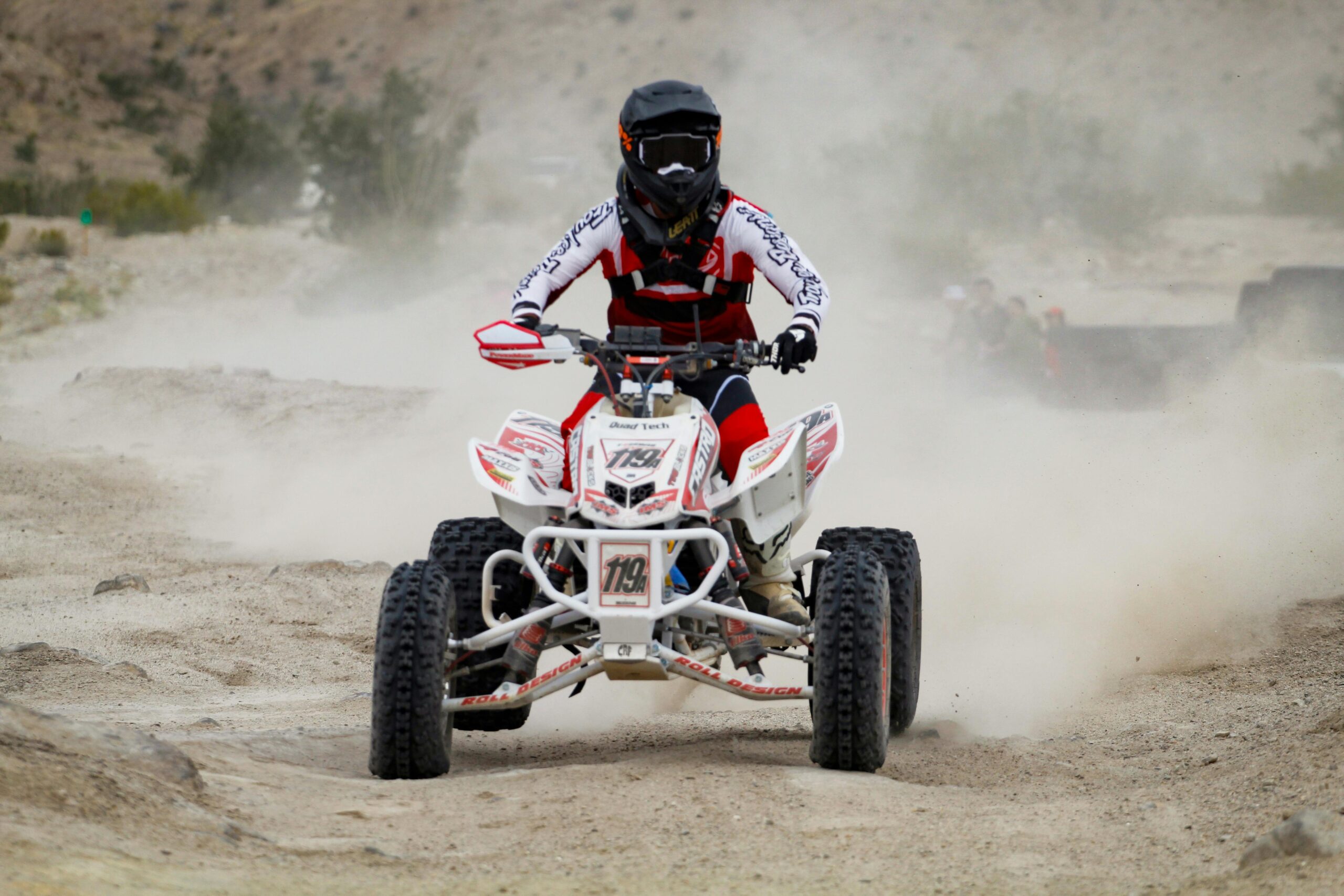 Desert quad bike safari with sandboarding fun and evening BBQ dinner experience in Dubai.