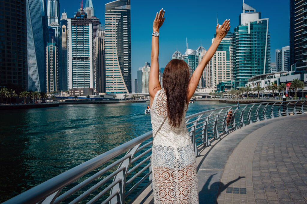 Dubai travel tourist woman on vacation walking