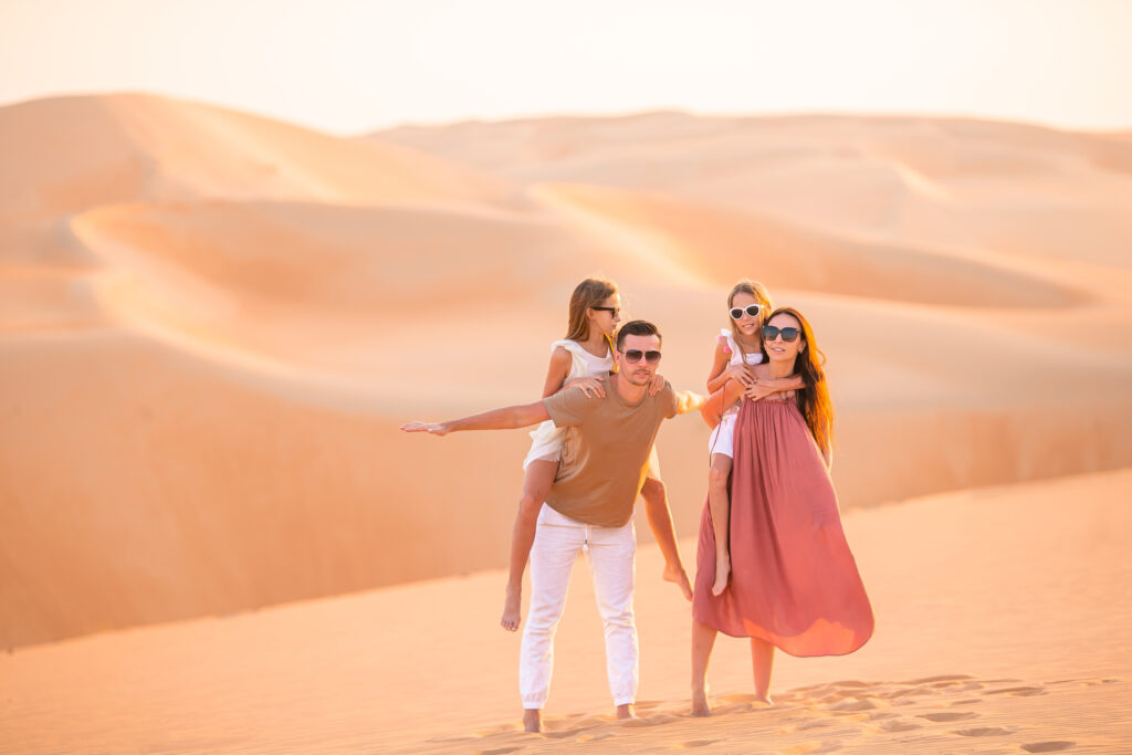 People among dunes in Rub al-Khali desert in United Arab Emirates