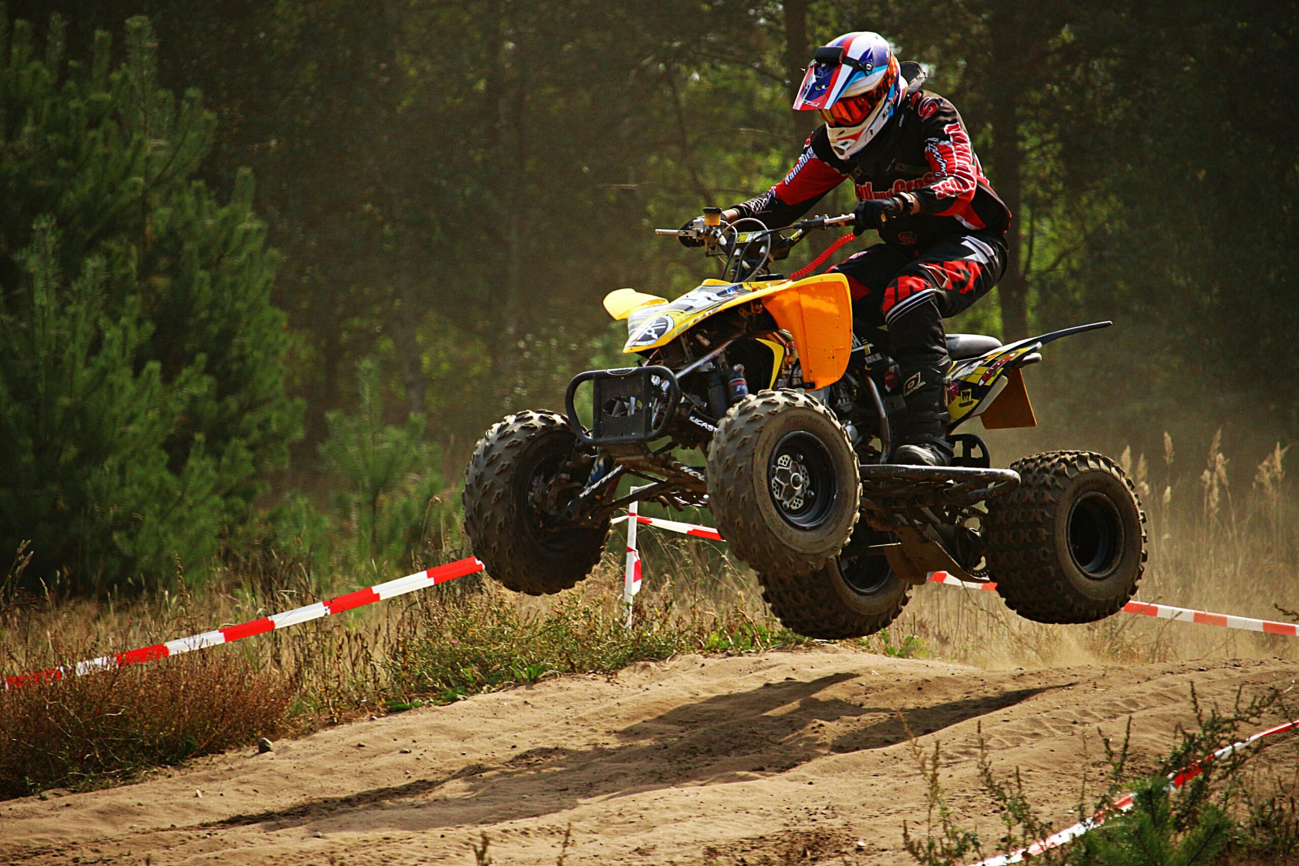 Desert quad bike safari with sandboarding fun and evening BBQ dinner experience in Dubai.
